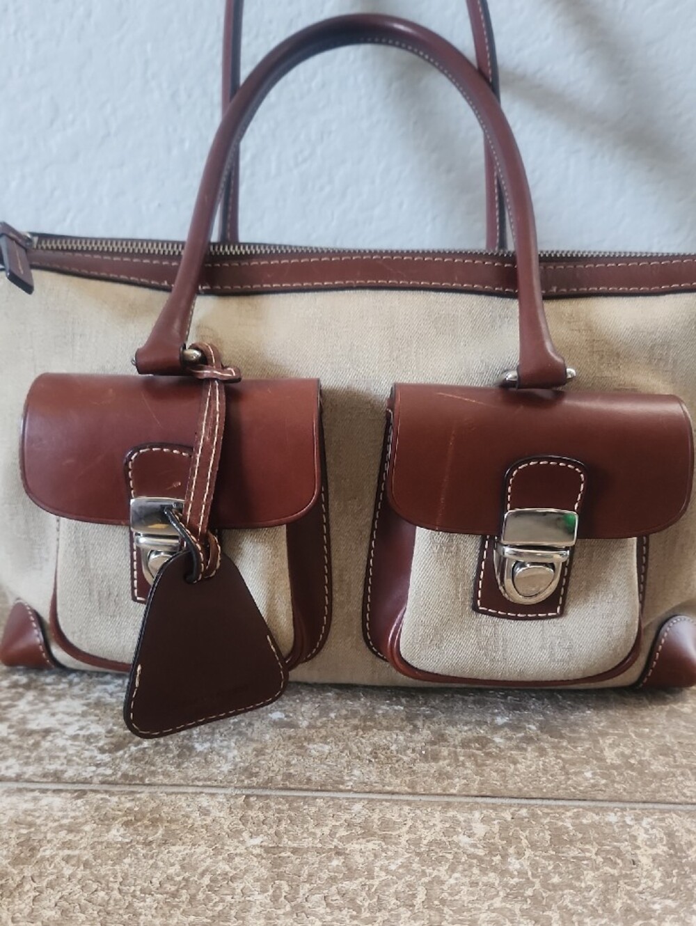 Dooney & Bourke Cream Canvas Satchel with Brown Leather Trim and Front Pockets